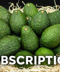 Fresh California avocados nestled in shredded paper for subscription delivery